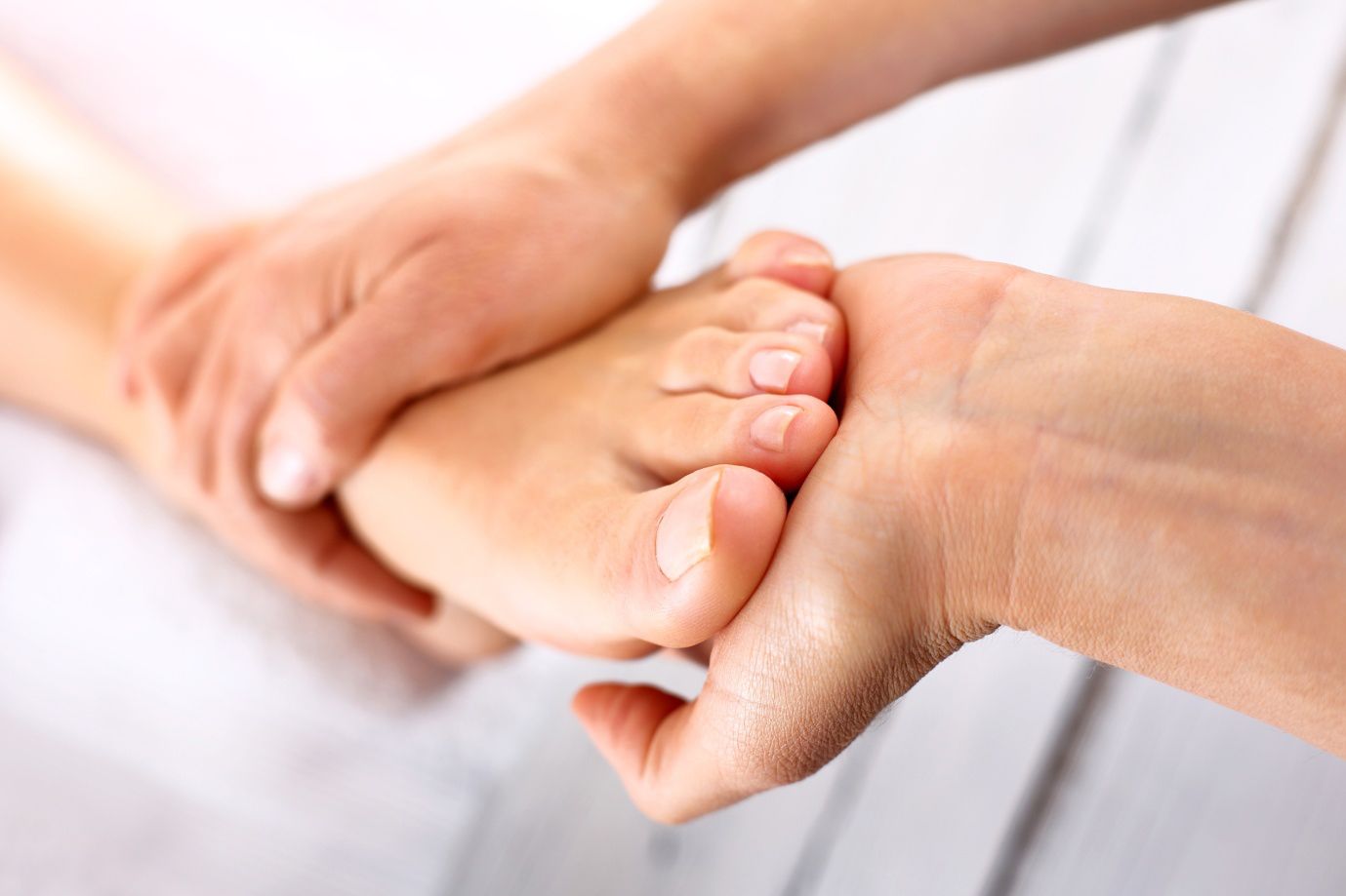 A picture of a chiropodist treating a sore foot. Cranstoun Footcare provides a professional and compassionate Podiatry and Chiropody service for the Lothians.